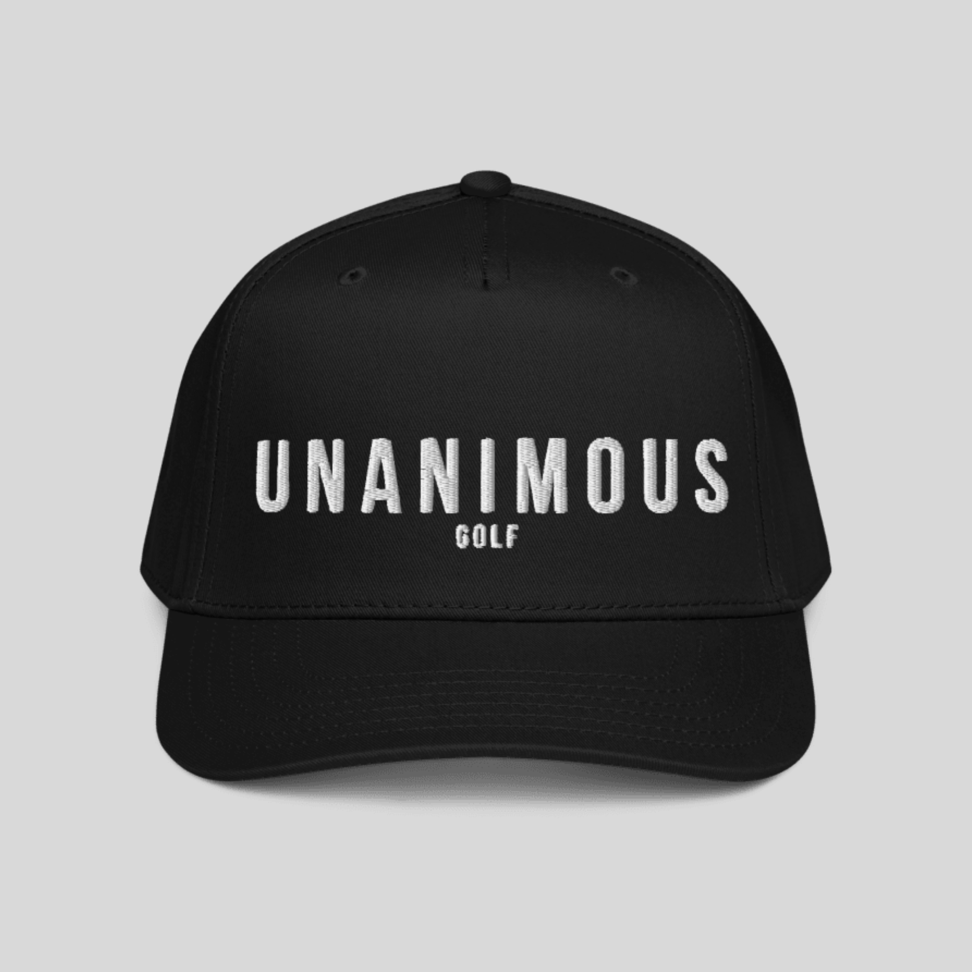 A black baseball cap with 'UNANIMOUS GOLF' embroidered in white across the front, shown against a solid light gray background.