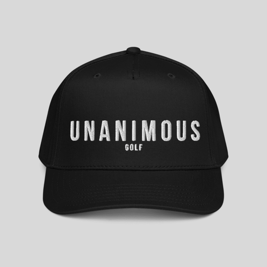 A black baseball cap with 'UNANIMOUS GOLF' embroidered in white across the front, shown against a solid light gray background.