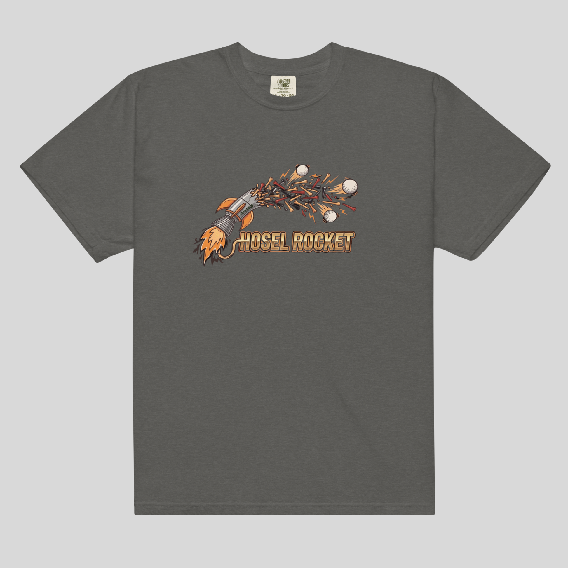 A pepper color comfort colors 1717 crewneck t-shirt featuring a graphic of a rocket ship blasting off with the text 'HOSEL ROCKET' in orange, displayed on a solid light gray background.