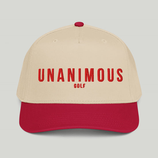 'UNANIMOUS GOLF' embroidered in white across the front, shown against a solid light gray background.